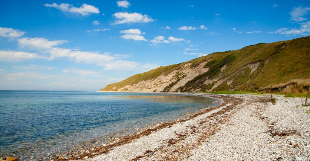 Nordøens sten og sandstrande.Feature