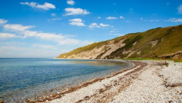 Nordøens sten og sandstrande.Feature