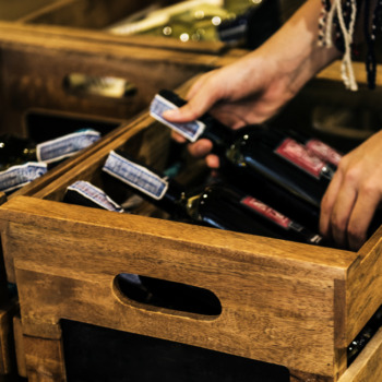 People Hands Getting Bottle of Red Wine