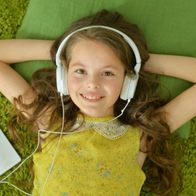 Cute little girl with headphones